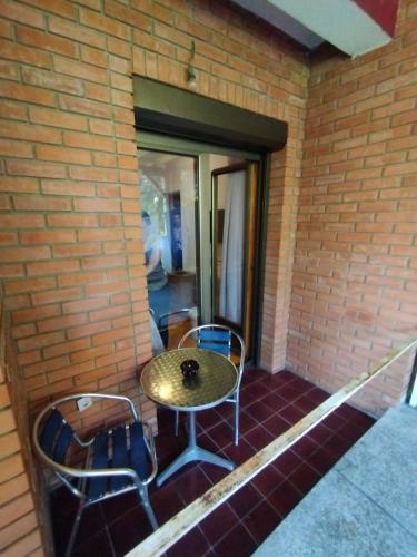 a table and chairs sitting on a porch at VILA MARKO in Niška Banja