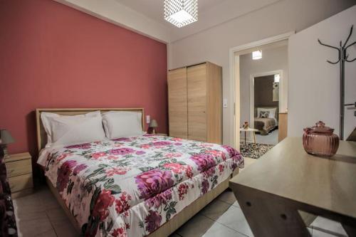 a bedroom with a bed and a desk in it at Dreamy cozy house.. in Kalabaka