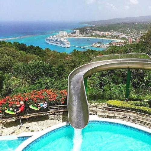 a plunge pool at a resort with a view of the ocean at OceanView Villa in Discovery Bay