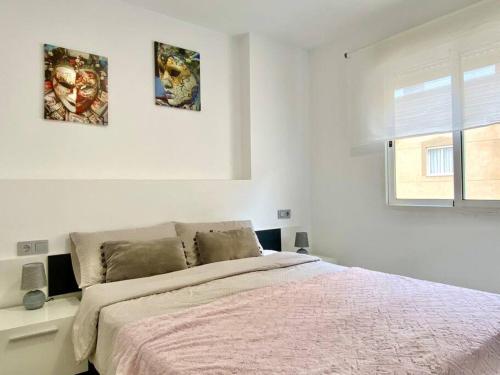 Ένα ή περισσότερα κρεβάτια σε δωμάτιο στο Pink Flower Apartment Torrevieja