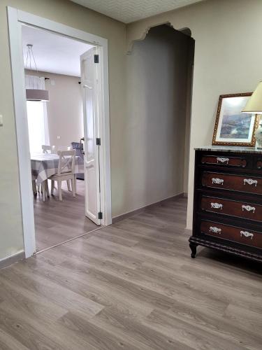 a living room with a dresser and a dining room at La Casa Alandí con garaje privado in Sagunto