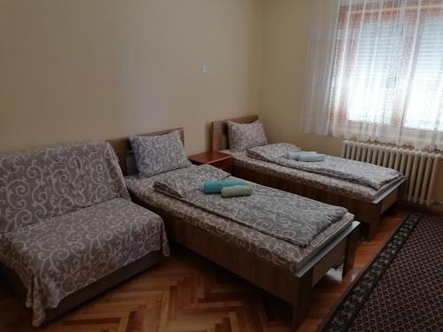 a living room with a couch and a chair at VILA MARKO in Niška Banja