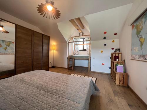 a bedroom with a large bed and a window at Deleni Retreat - Casa Sitaru in Deleni