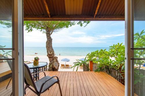 an open porch with a view of the beach at Veranda Lodge in Hua Hin