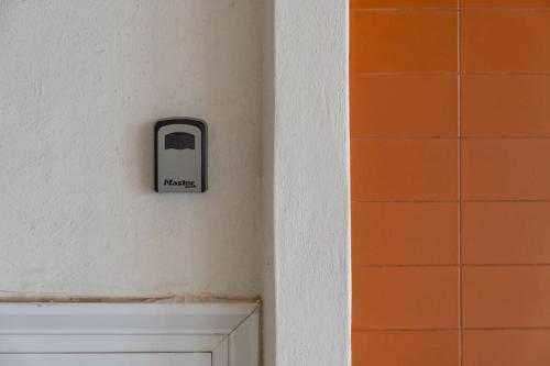 a switch on a wall next to a door at Your Home by the Sea for 3 in Xylokastro in Xylokastron