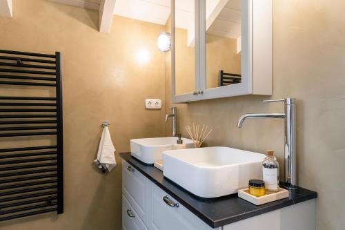 a bathroom with a white sink and a mirror at Mar-Gi 25 in Aiándion