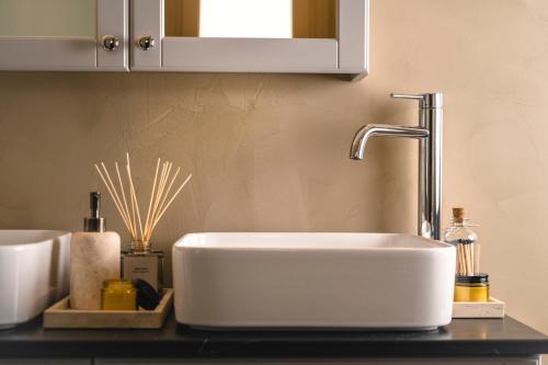 a white sink in a kitchen with a counter at Mar-Gi 25 in Aiándion