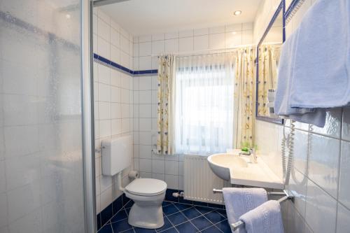 Kúpeľňa v ubytovaní Hotel Hammerwirt - Forellenhof