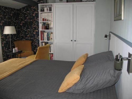 Säng eller sängar i ett rum på A La Rochelle proche Vélodyssée