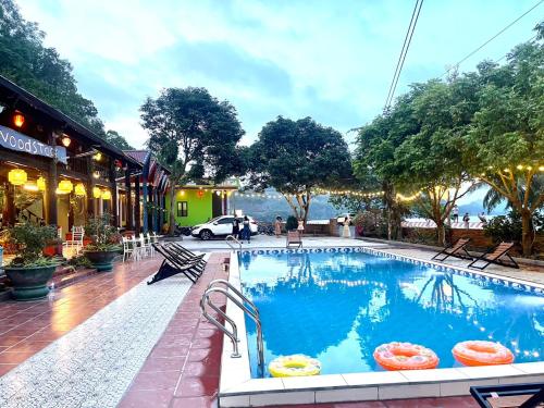 a pool at a hotel with a view of the water at Cat Ba SOL Beach in Cat Ba