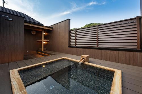 Piscina en o cerca de 猿投温泉金泉閣