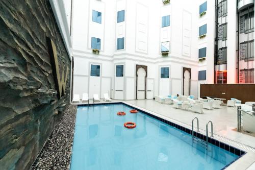 a swimming pool in the middle of a building at WA Hotel in Jeddah