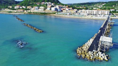 an aerial view of a beach with a pier at La Casa Di Lucia in San Vito Chietino