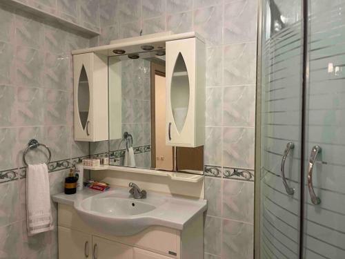 a bathroom with a sink and a mirror at Beautiful Apartment for rent in Beylikduzu