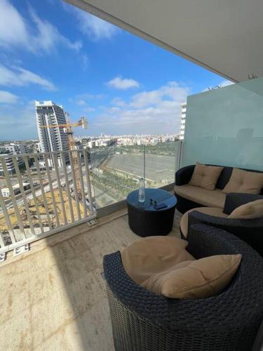 a balcony with a view of a city from a building at Superbe Appartement sécurisé avec un balcon in Casablanca