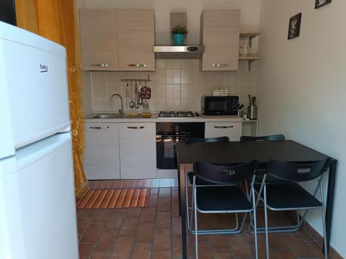 Virtuvė arba virtuvėlė apgyvendinimo įstaigoje Appartamento IN VILLA
