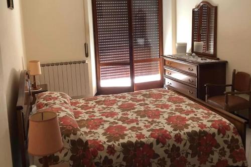 Кровать или кровати в номере Appartamento Incoronata