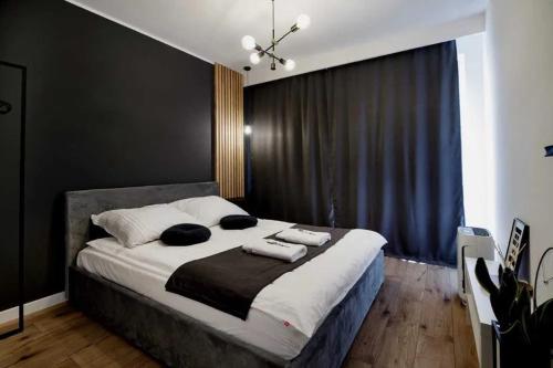 Ένα ή περισσότερα κρεβάτια σε δωμάτιο στο Apartament Aura