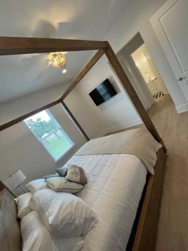 a bedroom with a bed in a room with a window at Beauty on the Beach Gulf Luxury w/ Gorgeous Views in Gulfport