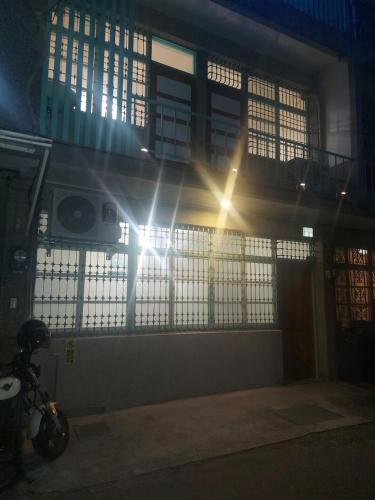 a building with the sun shining through the windows at 老宅小巷6人包棟民宿 in Taitung City