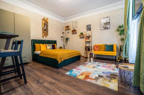 a bedroom with a bed and a chair and a rug at Colors of Budapest in Budapest
