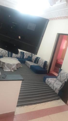 a room with a flat screen tv on top of a floor at hay massira 4 in Dakhla