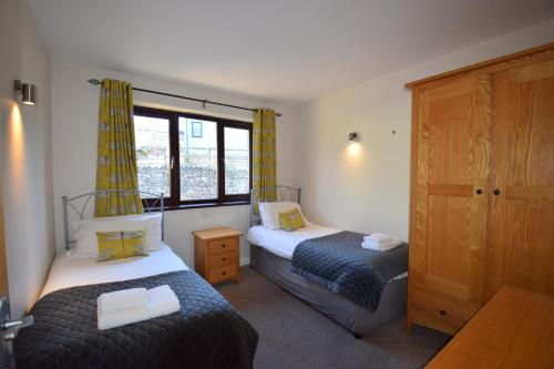 Ένα ή περισσότερα κρεβάτια σε δωμάτιο στο Beckside Cottage