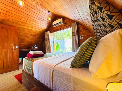 Letto o letti in una camera di Palmyra Nature Resort Sigiriya