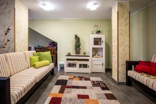 a living room with two couches and a table at Casa Rural Korteta in Tolosa