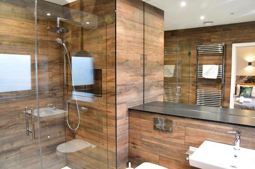 a bathroom with a shower and a sink at Parklands in Penrith