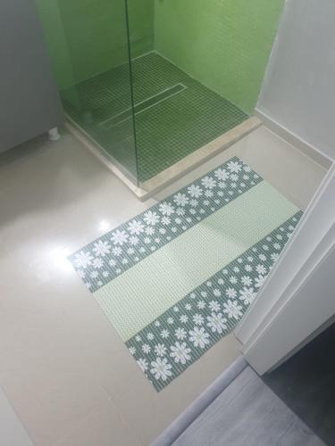 a bathroom with a shower with a glass door at Sun up Mamaia nord in Năvodari