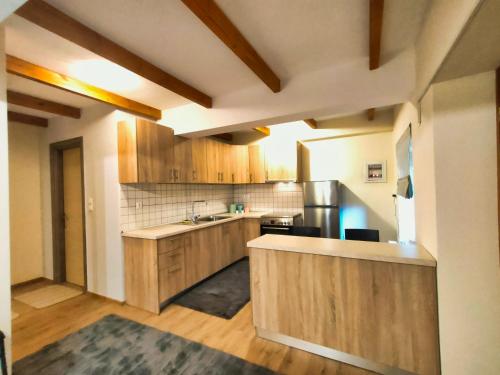 a kitchen with wooden cabinets and a counter top at Elegant Vista Residence in Metsovo