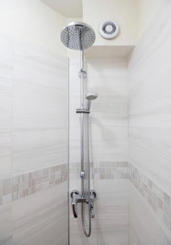 a shower with a glass door in a bathroom at Top Central Apartment & Free Parking in Sofia