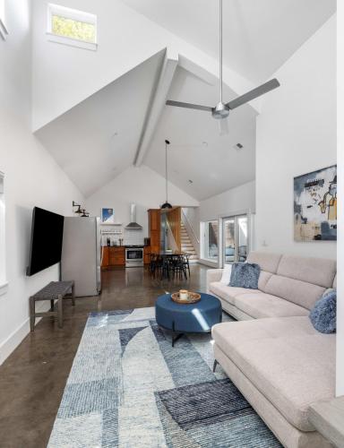 a living room with a couch and a table at The Polygon Park Circle Mins to Dwtn and Beach in Charleston