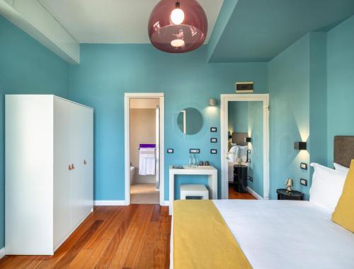 Postel nebo postele na pokoji v ubytování Rosabianca Boutique Hotel