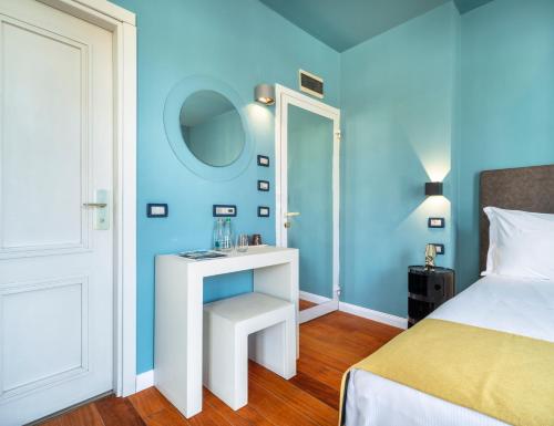 Postel nebo postele na pokoji v ubytování Rosabianca Boutique Hotel