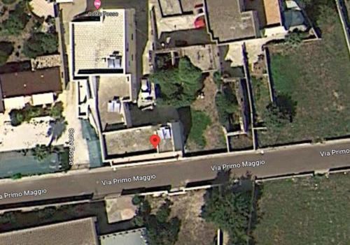 eine Karte eines Hauses mit einem roten Kreis in der Unterkunft Casa Stella in Uggiano la Chiesa