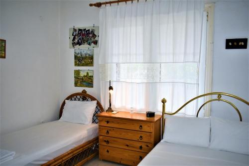 Ένα ή περισσότερα κρεβάτια σε δωμάτιο στο Eva Seaside 1st Floor