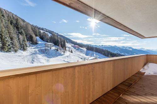 a balcony with a view of a snow covered mountain at Ridge302 in Bourg-Saint-Maurice