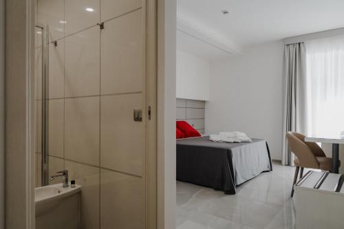 Postel nebo postele na pokoji v ubytování RIMIR Hotel & Centro Benessere