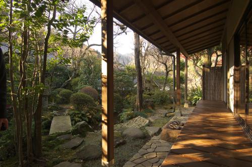 a porch of a house with a walkway at Gyokutei in Hakone