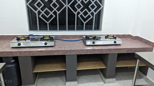 Dapur atau dapur kecil di Mufasa city Hostel and Apartments