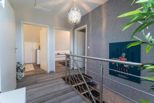 a staircase in a home with a stair railing at Leeloo s Sunlight in Hodenhagen