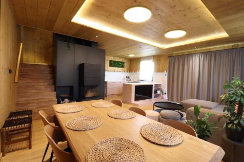 a large dining room with a table and chairs at CHALET COBURG in Telgárt