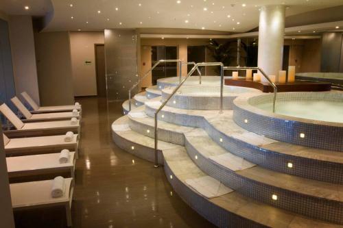 a row of jacuzzi baths in a hotel at 07F Resort Breathtaking Ocean Views Panama Canal in ArraijÃ¡n