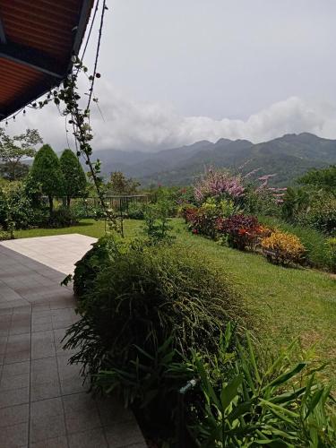 a view of a garden with mountains in the background at Hotel Anachoreo in Santa Fe