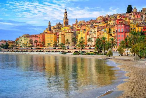 a city on the shore of a body of water at VieuxChateau in Menton