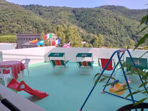 a group of chairs and tables on a roof at Luigiane B&B in Acquappesa