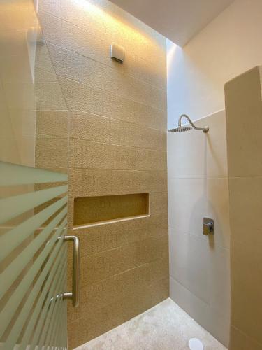 a shower with a glass door in a bathroom at Casa Mon Repos en Careyes in Careyes
