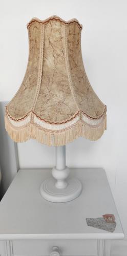 a lamp on top of a white table at Mosel Boutique in Bruttig-Fankel